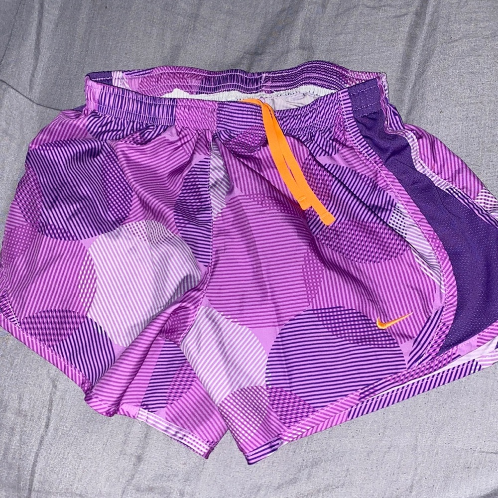 Nike purple athletic shorts with orange drawstring